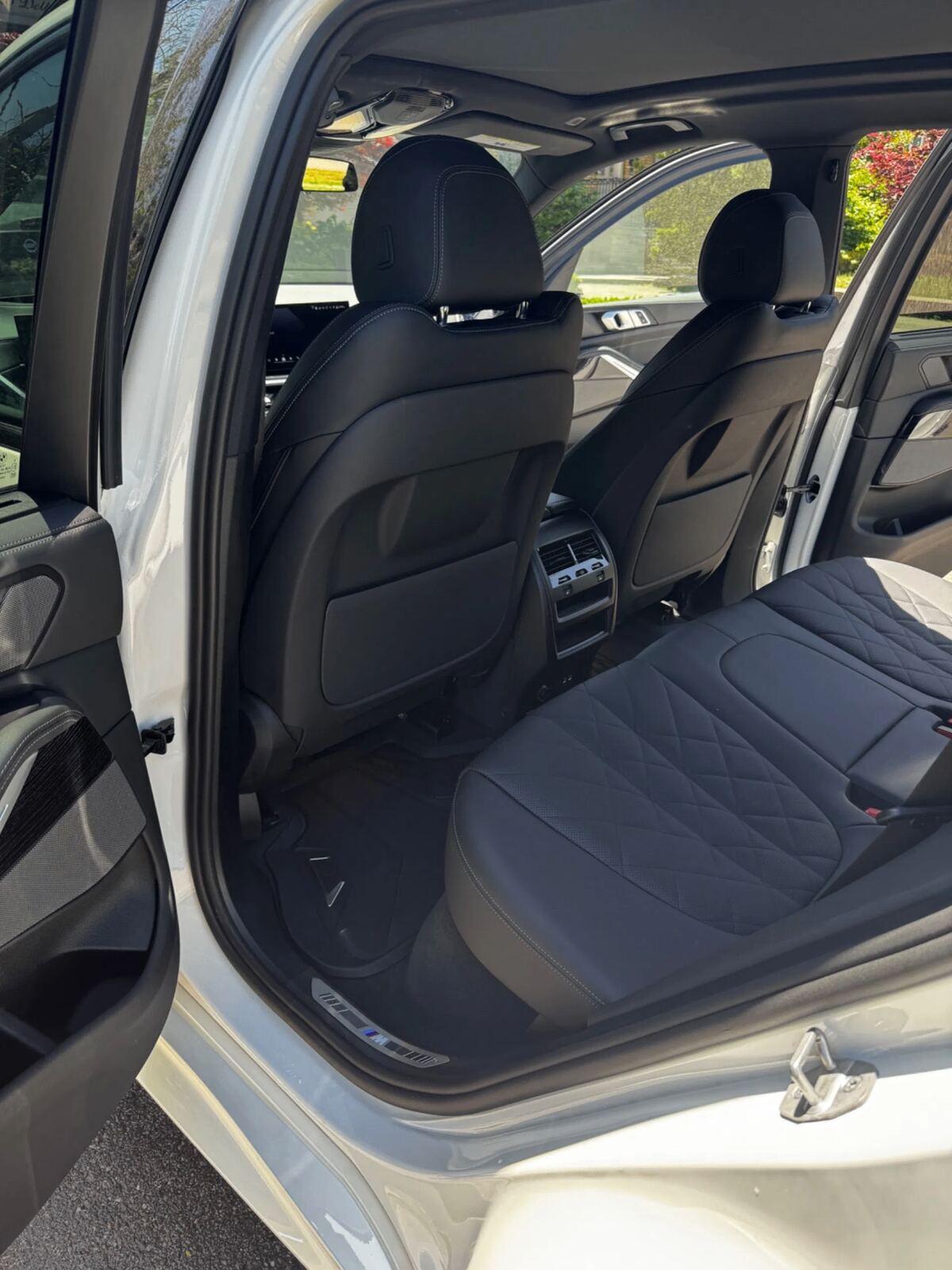 BMW rear cabin after full interior detail — conditioned diamond-stitched leather