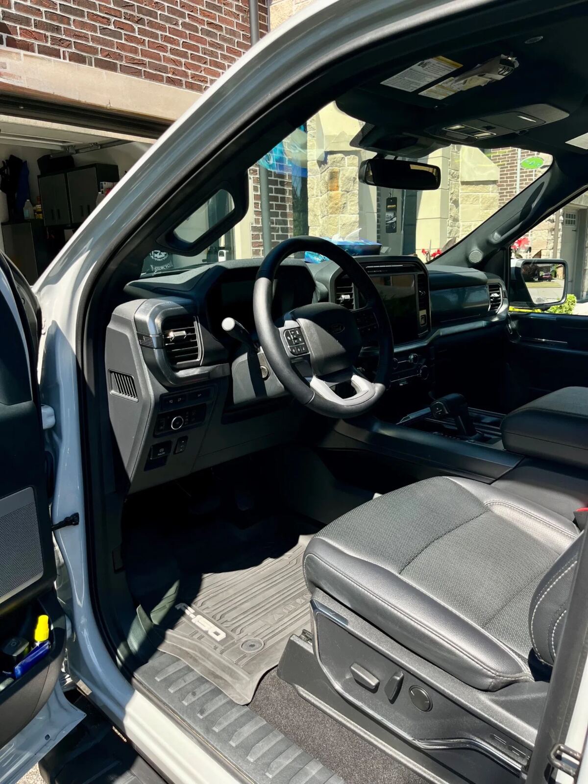 Ford F-150 driver cabin after full interior detail — cleaned leather seats and dashboard