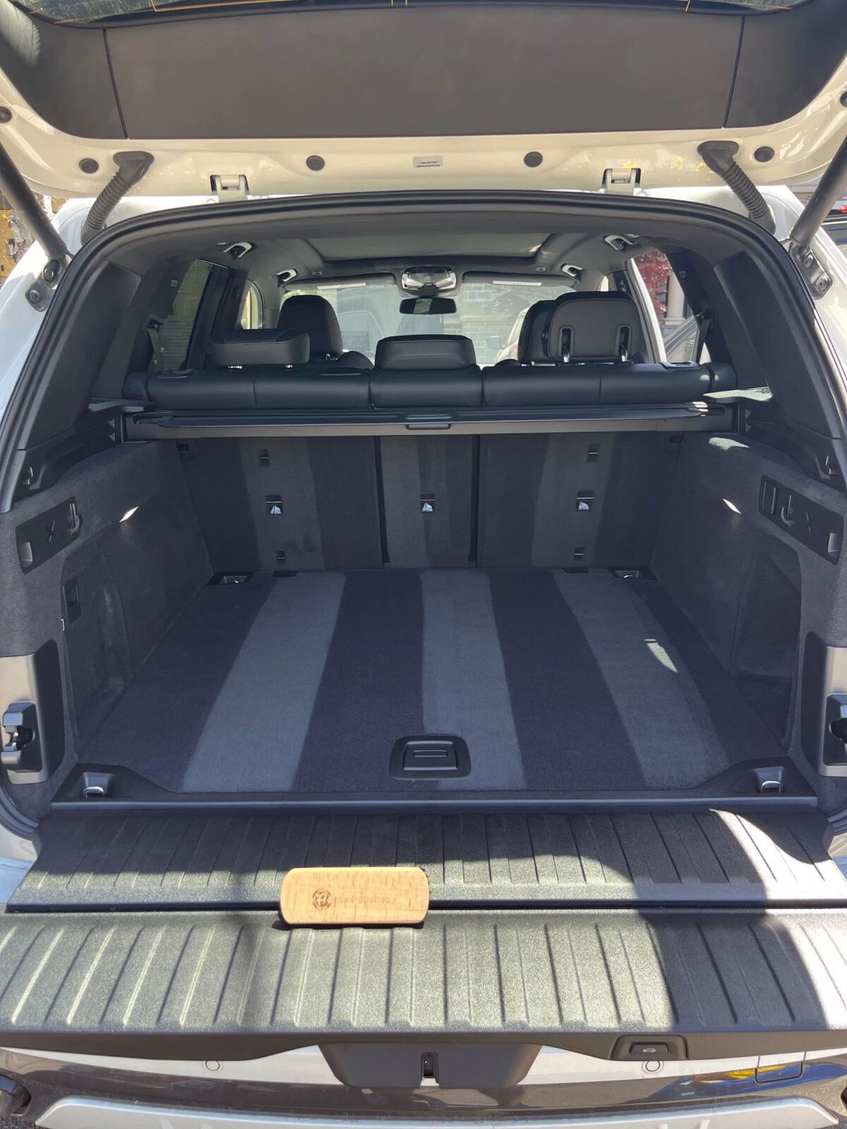 Freshly vacuumed BMW X5 cargo area with spotless carpet lining