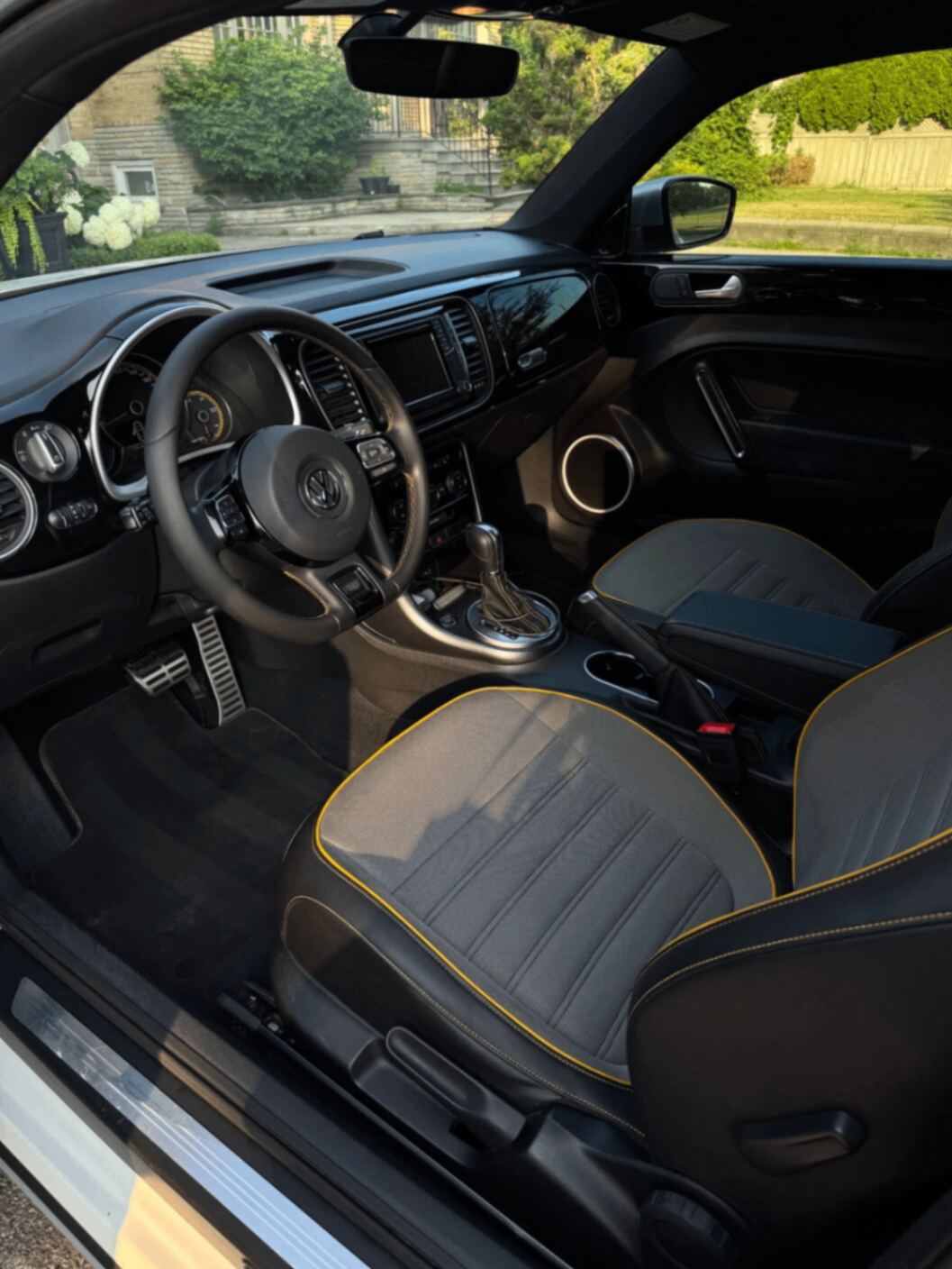 Volkswagen Beetle interior detail — polished dash and clean two-tone seats